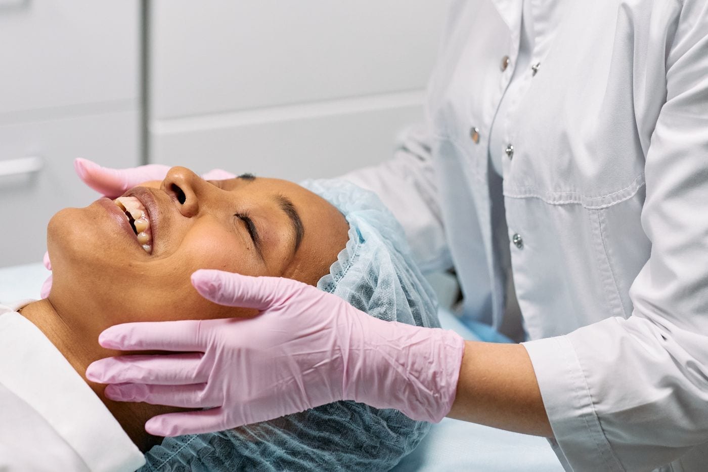 Aesthetician giving a patient a facial treatment