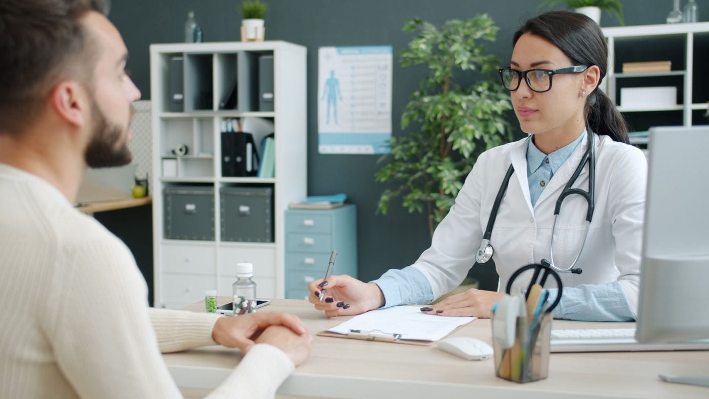 Doctor consulting with a patient in a clinic office