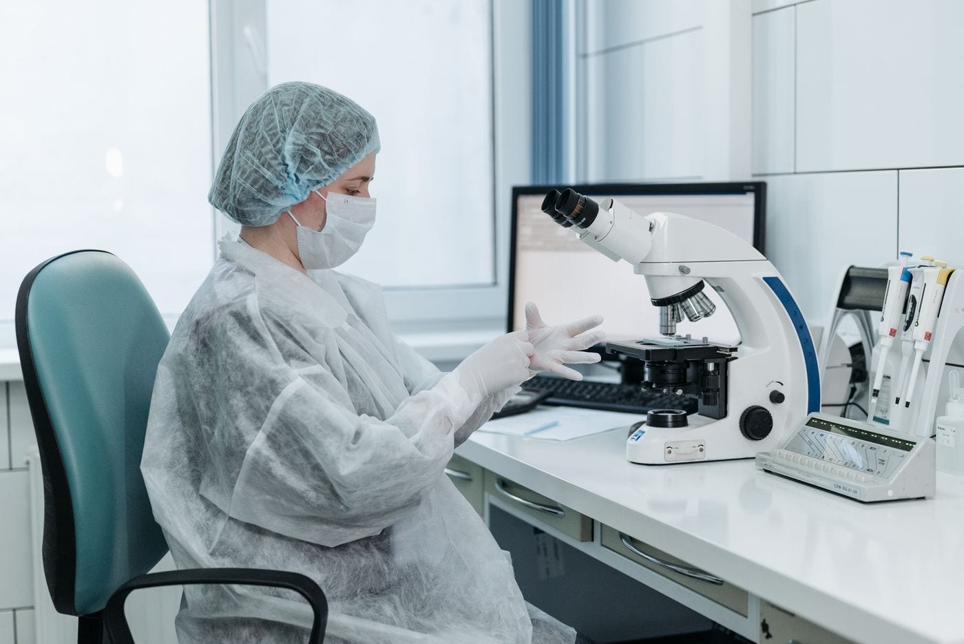 Lab technician examining a sample in a diagnostic laboratory