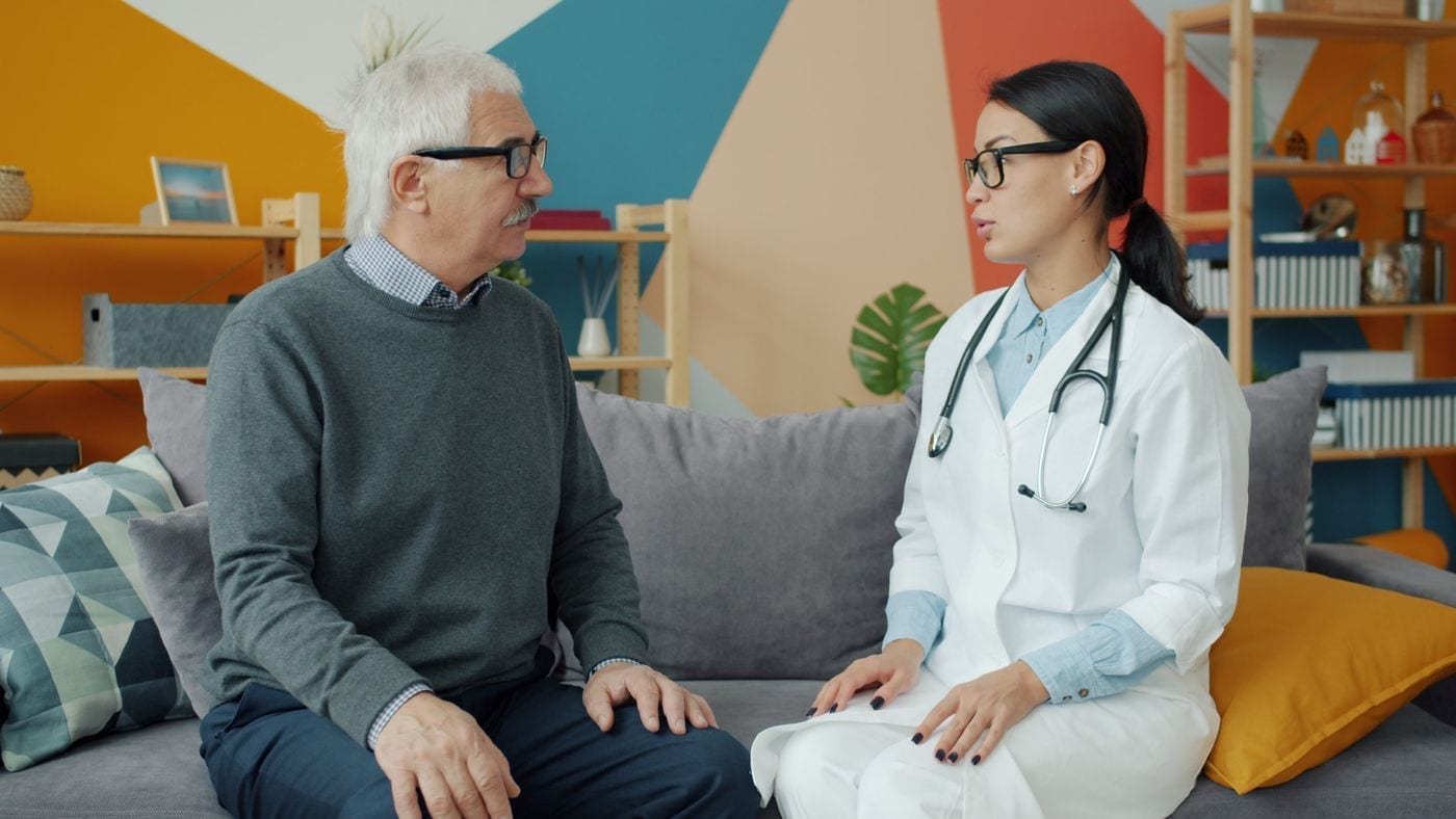 Senior patient speaking with a doctor