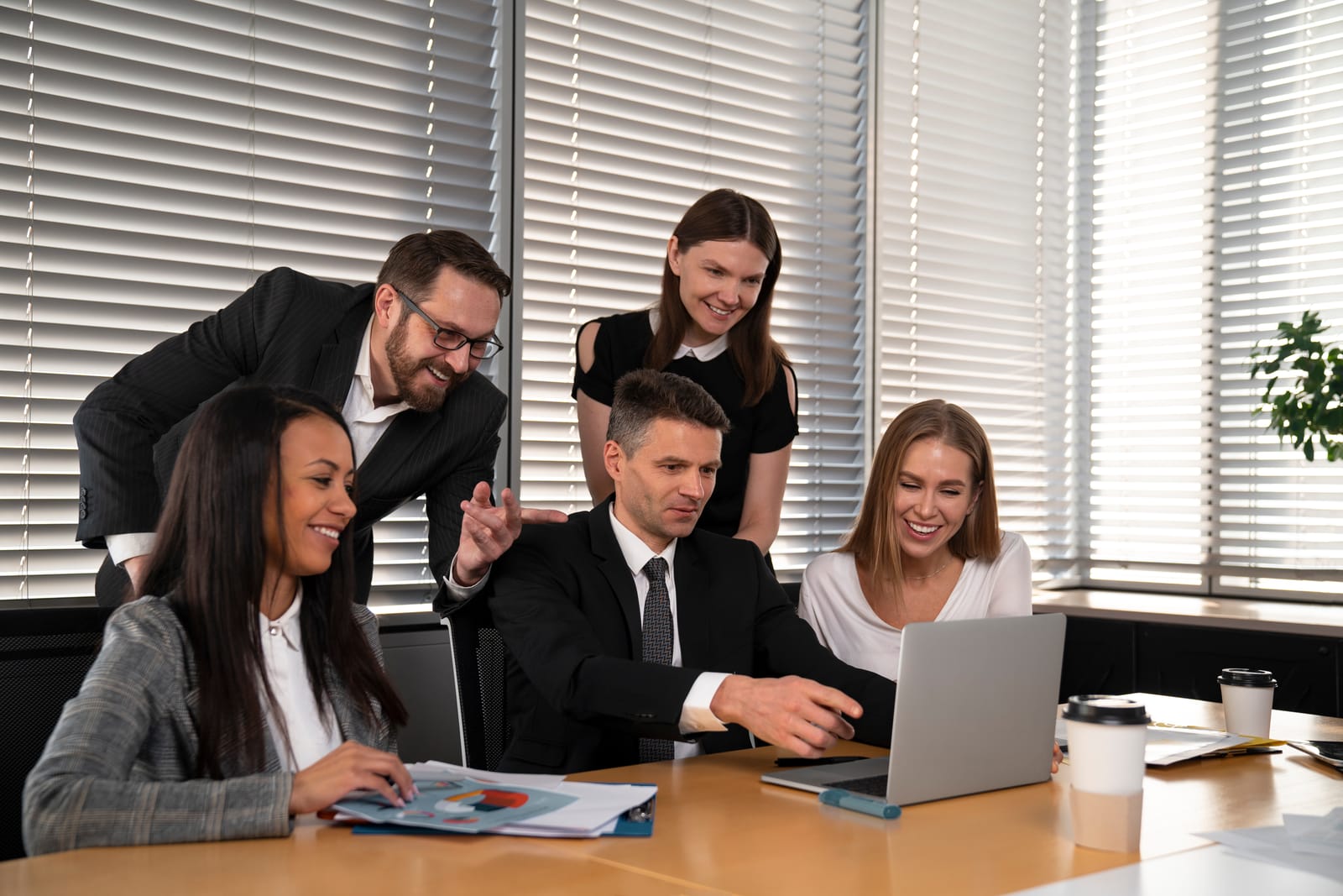 HR and business teams collaborating in a modern office